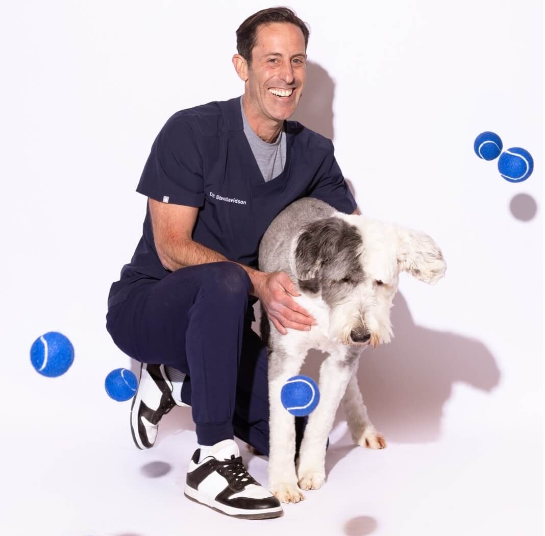 Dr. Steven Davidson holding a dog